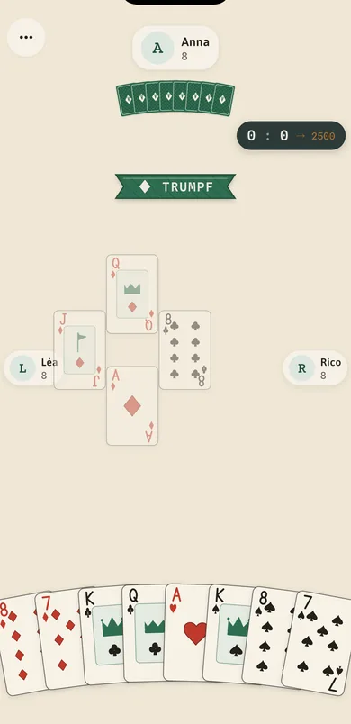The Jasvel table in play: a nine-card hand at the bottom, the trump banner across the middle and the running match score on the slate.